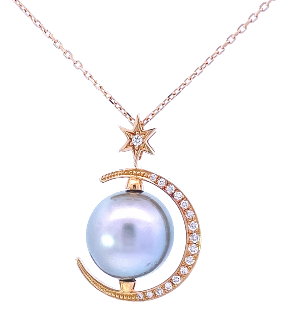 Pearl pendant with moon and star motifs