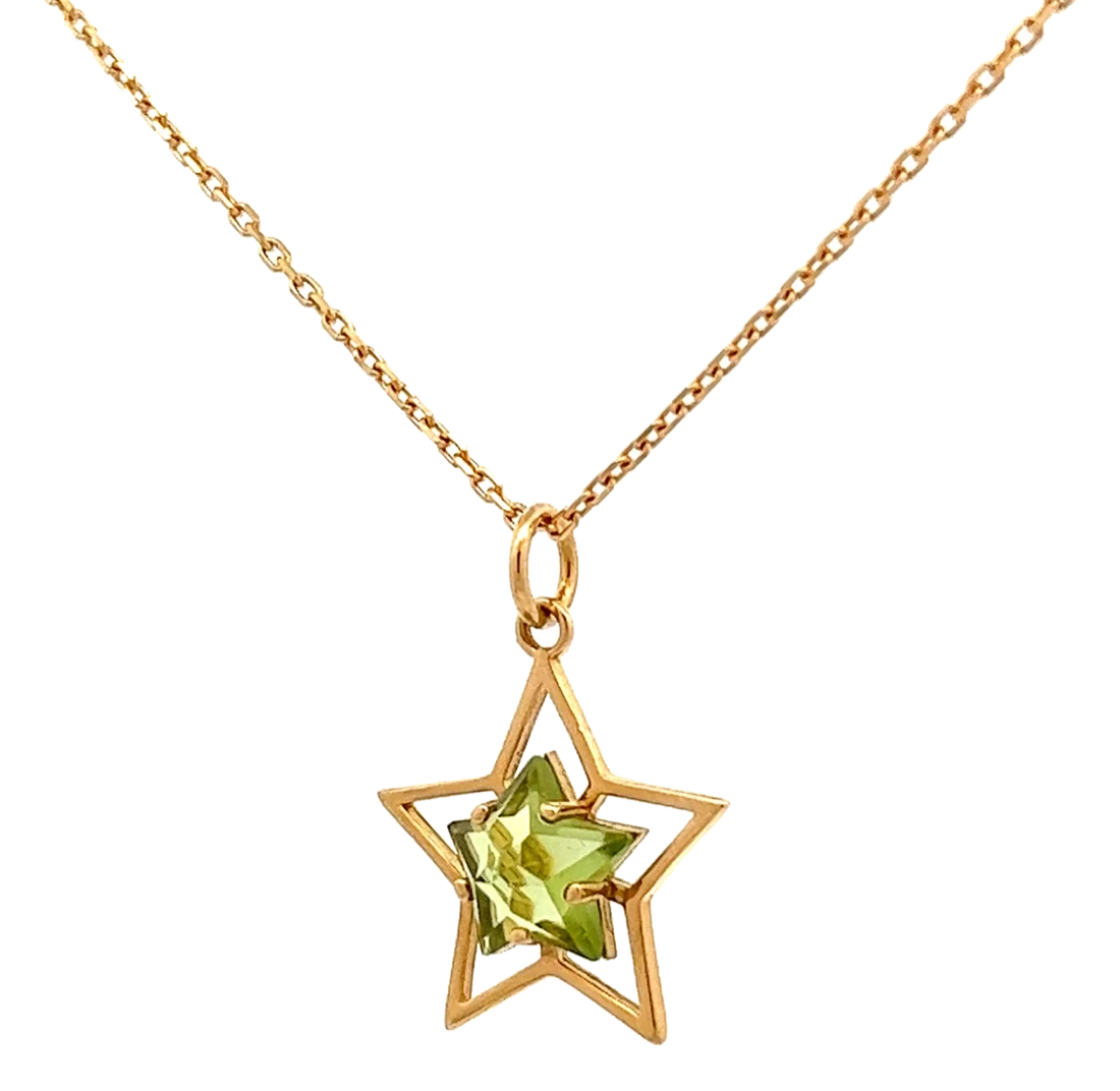 Pendant: a small star holding a soft green gem